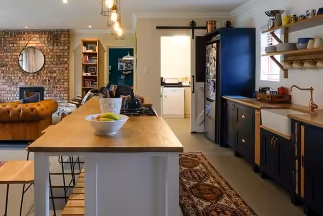 Renovated kitchen with timber island and navy cabinetry